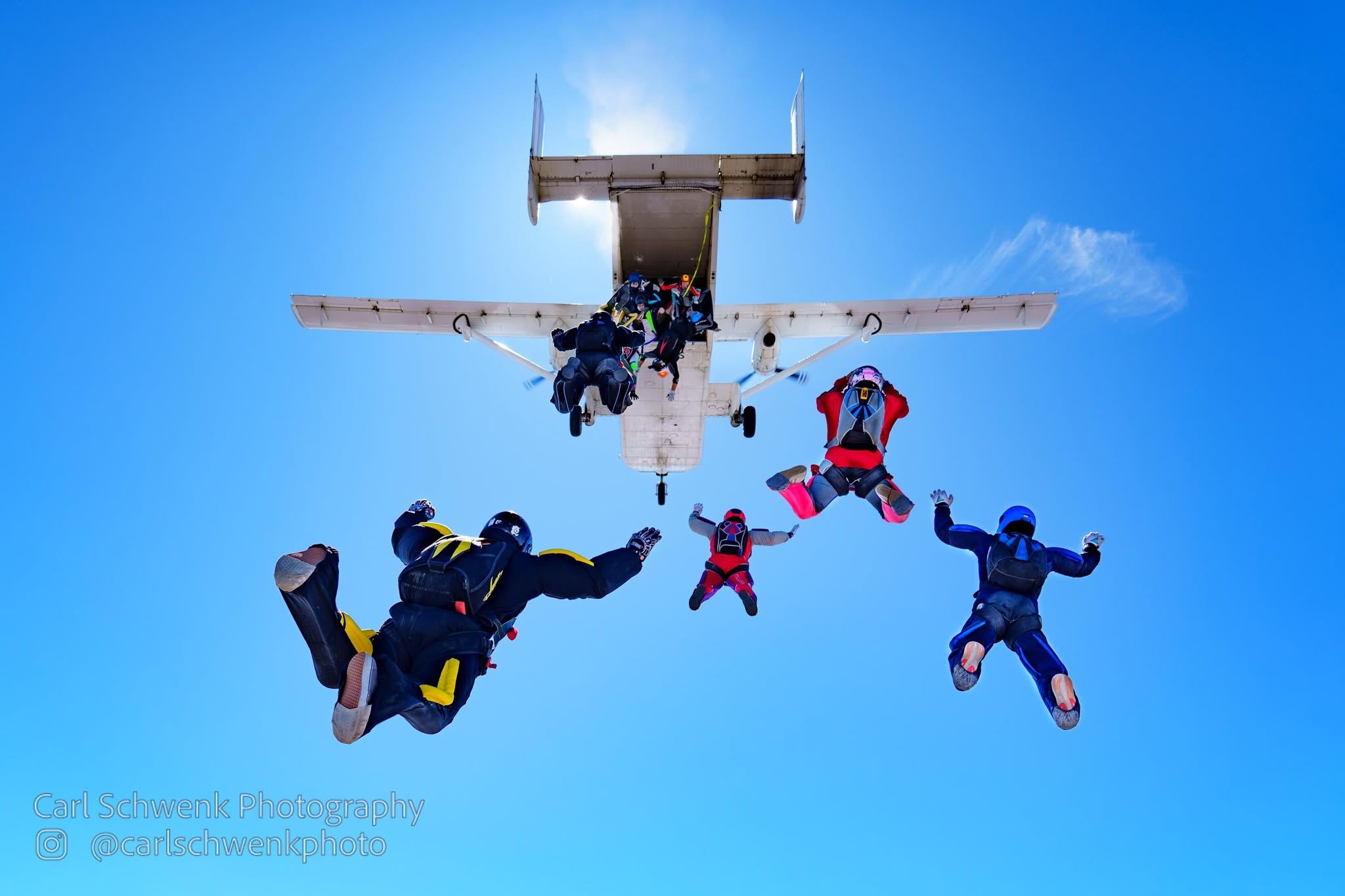 Skydivers leaving an aircraft over Perris, photographed by Carl Schwenk